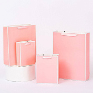 Пакет бумажный розовый с лентой (22*10*20)